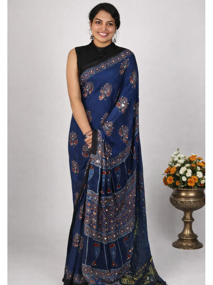MIZHI Ajrakh modal silk saree with intricate mirror work, showcasing vibrant traditional patterns and elegant craftsmanship.