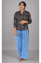 Black cotton shirts by MIZHI, featuring a comfortable fit and classic design, displayed on a flat lay.