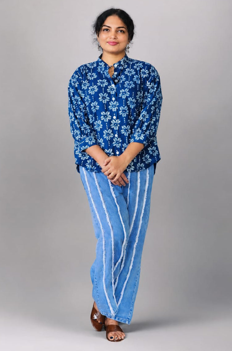 Light blue MIZHI cotton shirts laid out flat, showcasing the soft fabric and classic button-down design.