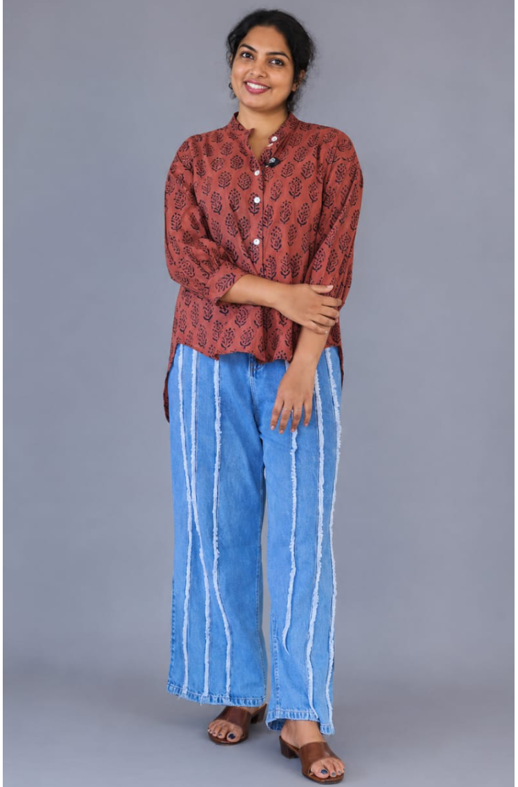 Red MIZHI cotton shirt displayed on a hanger, showcasing its soft fabric and classic button-up design.
