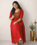Red Georgette A-Line pleated dress by MIZHI featuring flowing fabric and elegant pleats, perfect for stylish occasions.