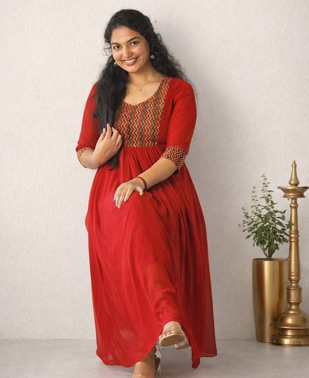 Red Georgette A-Line pleated dress by MIZHI featuring flowing fabric and elegant pleats, perfect for stylish occasions.