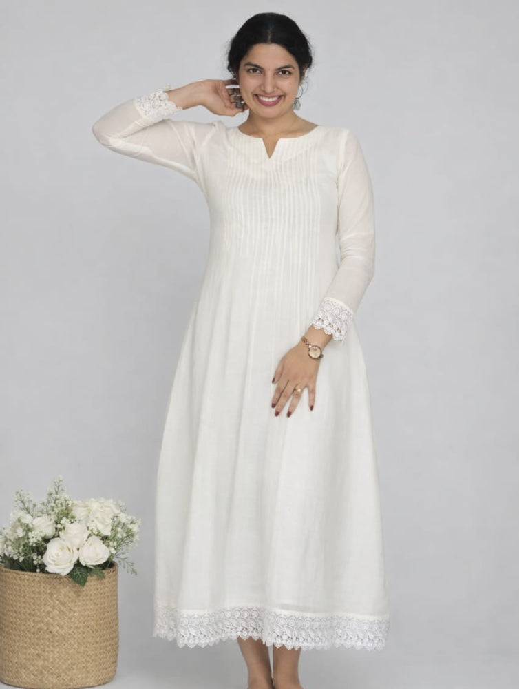 Kora cotton lace dress by MIZHI featuring pintuck design, delicate lace details, and a feminine, elegant silhouette.