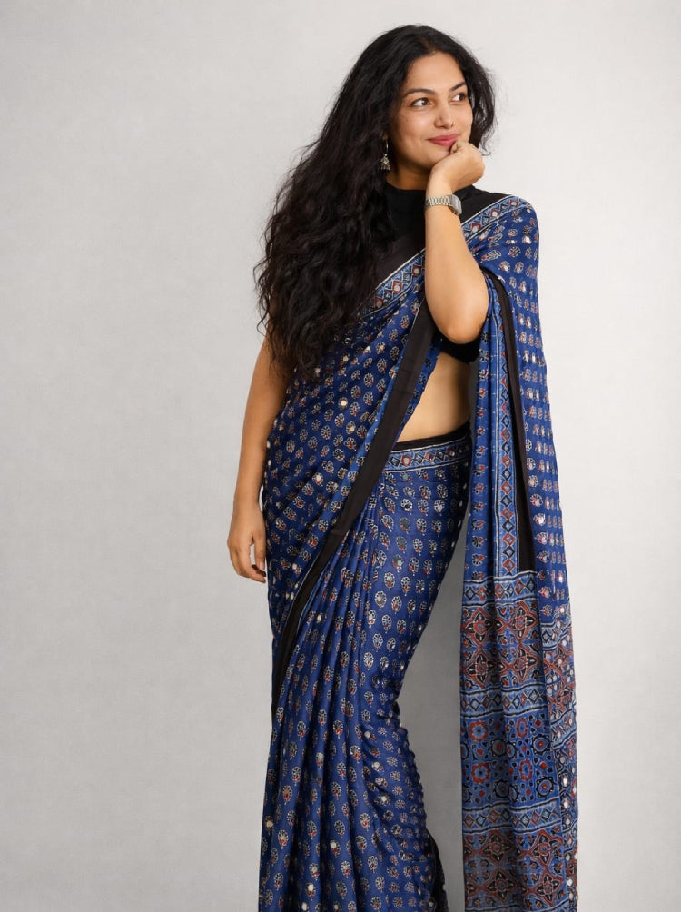 Blue Ajrak Mirror Work Saree by MIZHI with intricate traditional Ajrakh patterns and mirror embellishments.