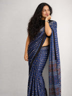 Blue Ajrak Mirror Work Saree by MIZHI with intricate traditional Ajrakh patterns and mirror embellishments.