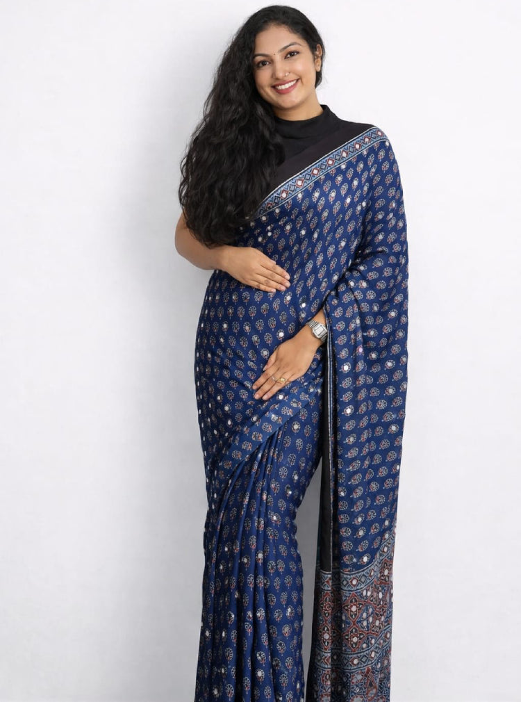 Elegant Mirror Work Ajrakh Saree by MIZHI featuring traditional Ajrak patterns and intricate mirror embellishments on fabric