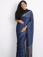 Elegant Mirror Work Ajrakh Saree by MIZHI featuring traditional Ajrak patterns and intricate mirror embellishments on fabric