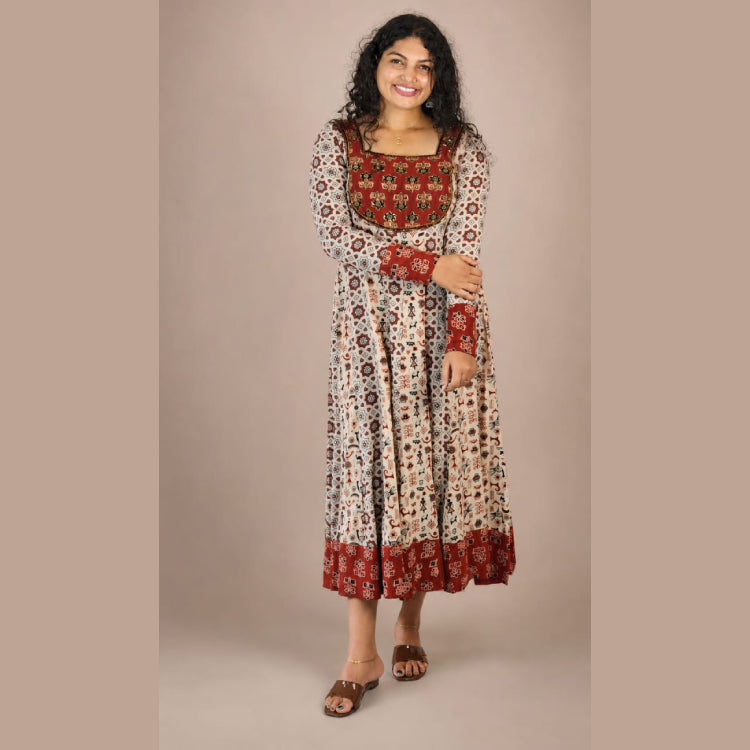 MIZHI Ajrak panneled Anarkali dress in beige with traditional Ajrak print, flowing silhouette, and intricate pattern details.