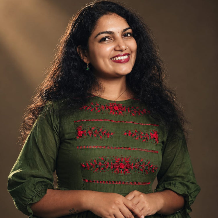 Green cotton A-line kurti from MIZHI featuring an elegant design and flattering A-line silhouette, perfect for casual or festive wear.