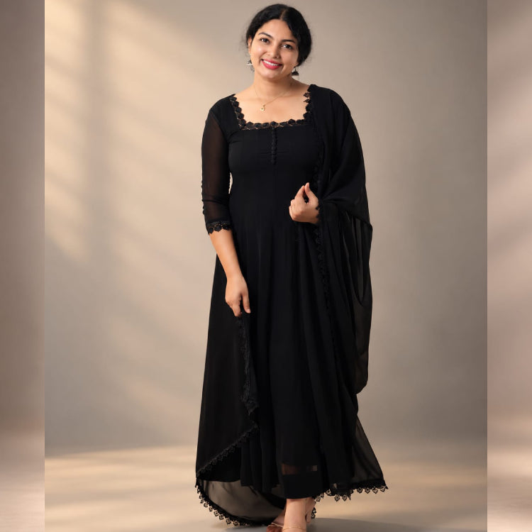 Black paneled Anarkali dress in georgette fabric by MIZHI, featuring intricate paneling and elegant design.