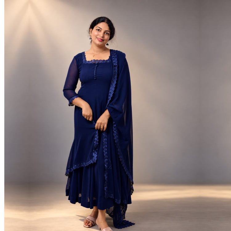 Blue paneled Anarkali dress in georgette fabric by MIZHI, featuring intricate panel designs and flowing silhouette.