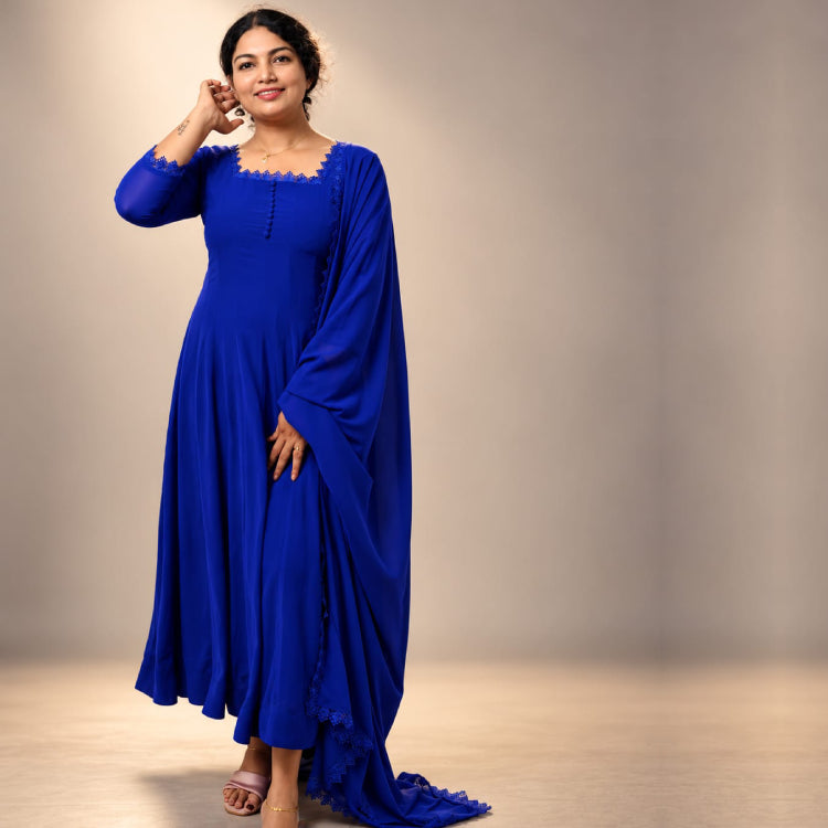 Blue paneled Georgette Anarkali dress by MIZHI with intricate embroidery and a flowing silhouette.