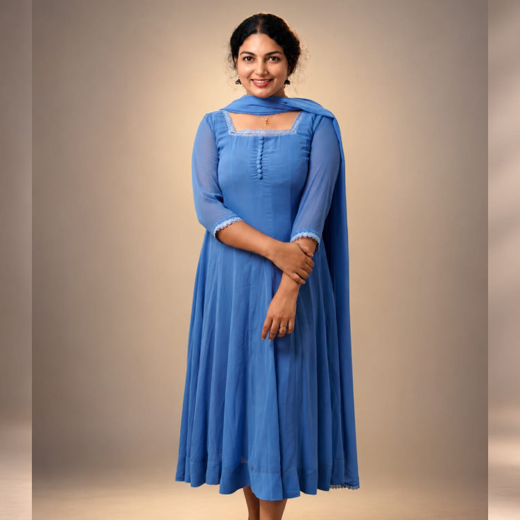 Blue paneled Anarkali in georgette by MIZHI, showcasing intricate design and flowing fabric with detailed paneling.