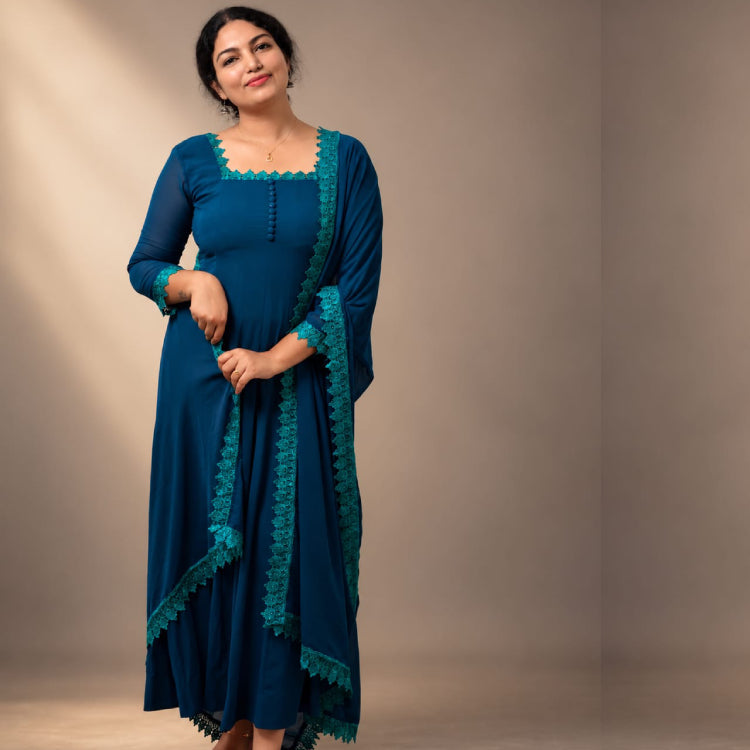 Blue paneled Anarkali in georgette fabric by MIZHI, featuring intricate paneling and elegant design.