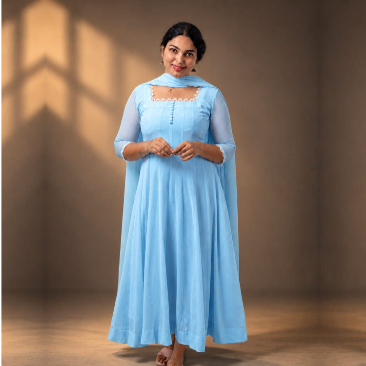 Sky blue georgette paneled Anarkali dress by MIZHI featuring intricate embroidery and flowing fabric, perfect for festive occasions.