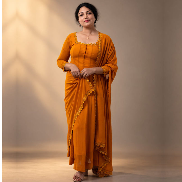 Yellow paneled Anarkali dress in georgette fabric by MIZHI, featuring traditional embroidery and flowy design.