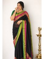 Black MIZHI mul cotton saree draped elegantly, showcasing its soft texture and traditional design.