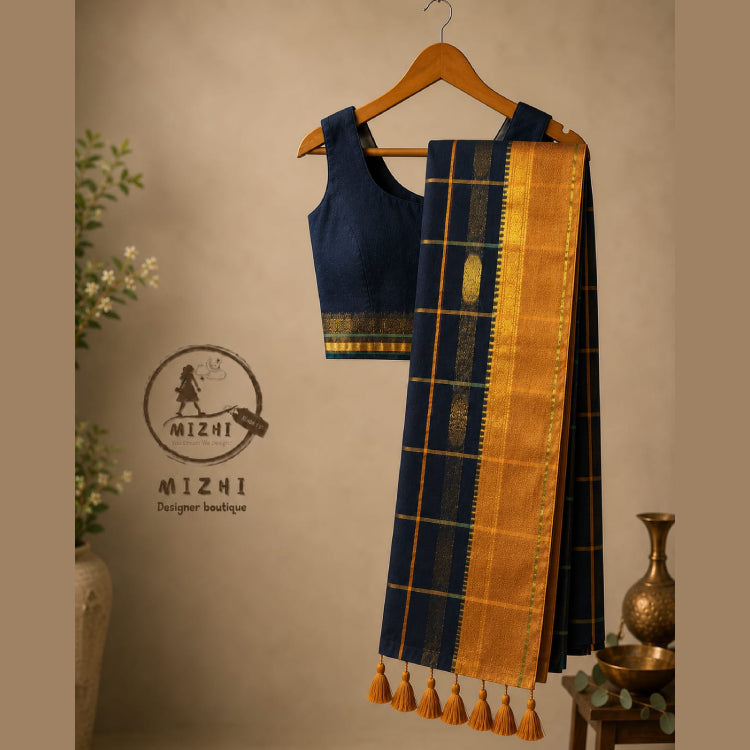 Black Mul Cotton Saree with golden border from MIZHI, featuring a smooth black fabric and elegant golden accents.