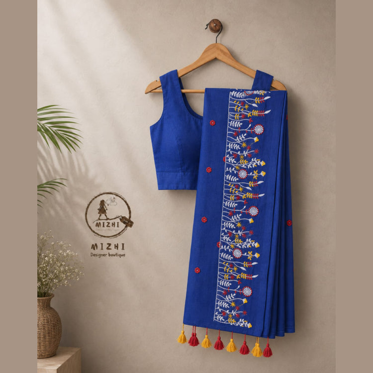 Blue MIZHI embroidered mul cotton saree with intricate designs, showcasing traditional craftsmanship and soft, lightweight fabric.