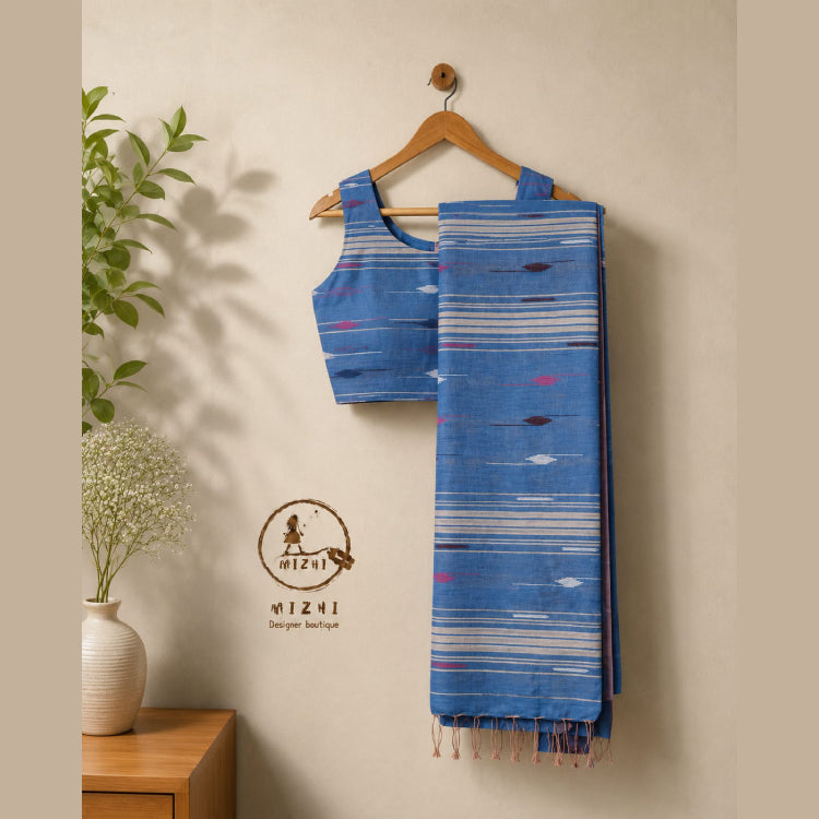 Blue cotton saree with traditional jamdhani patterns from MIZHI, showcasing intricate craftsmanship and vibrant color.