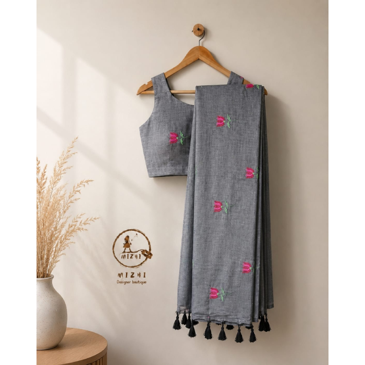 Charcoal grey handcrafted floral Mul Cotton saree by MIZHI, featuring intricate floral patterns and traditional craftsmanship.