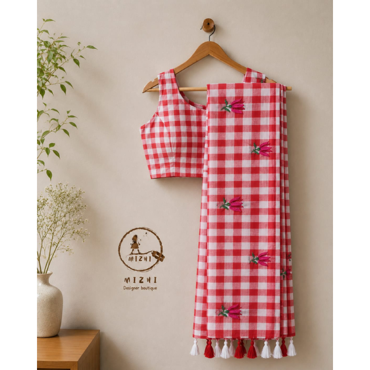 Red and white checked handcrafted floral Mul Cotton saree by MIZHI with intricate floral designs and traditional check pattern.