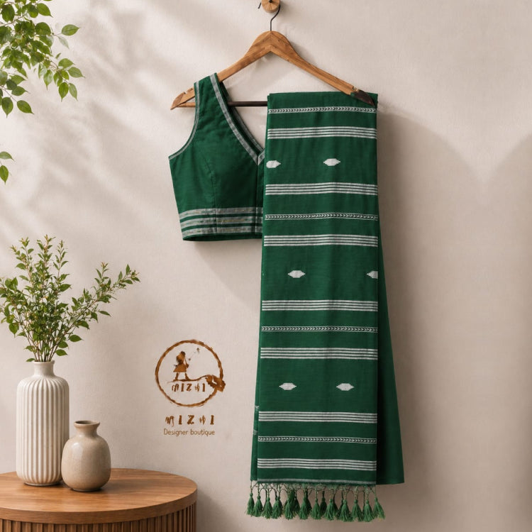 Emerald green Jamdani Mul Cotton Saree with intricate traditional patterns, showcasing vibrant craftsmanship by MIZHI.