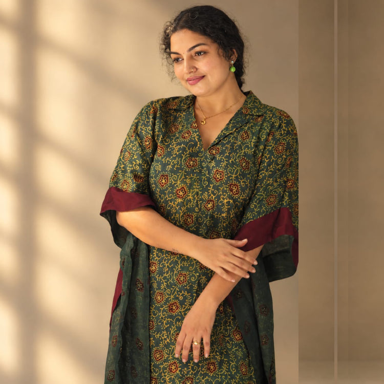 Green Ajrakh Modal Silk Kaftan by MIZHI featuring traditional Ajrakh-inspired print and flowing, elegant design.