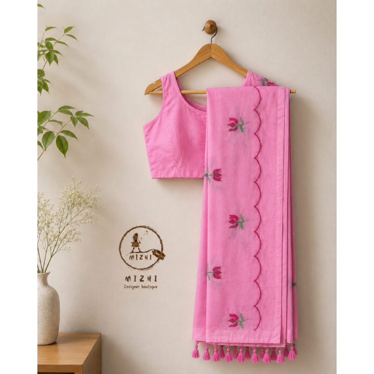 Candy pink handcrafted floral Mul cotton saree with scallop border from MIZHI, featuring intricate lotus floral design.