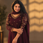 Burgundy paneled Anarkali kurta with intricate ajrak detailing by MIZHI, showcasing elegant traditional embroidery and fabric design.