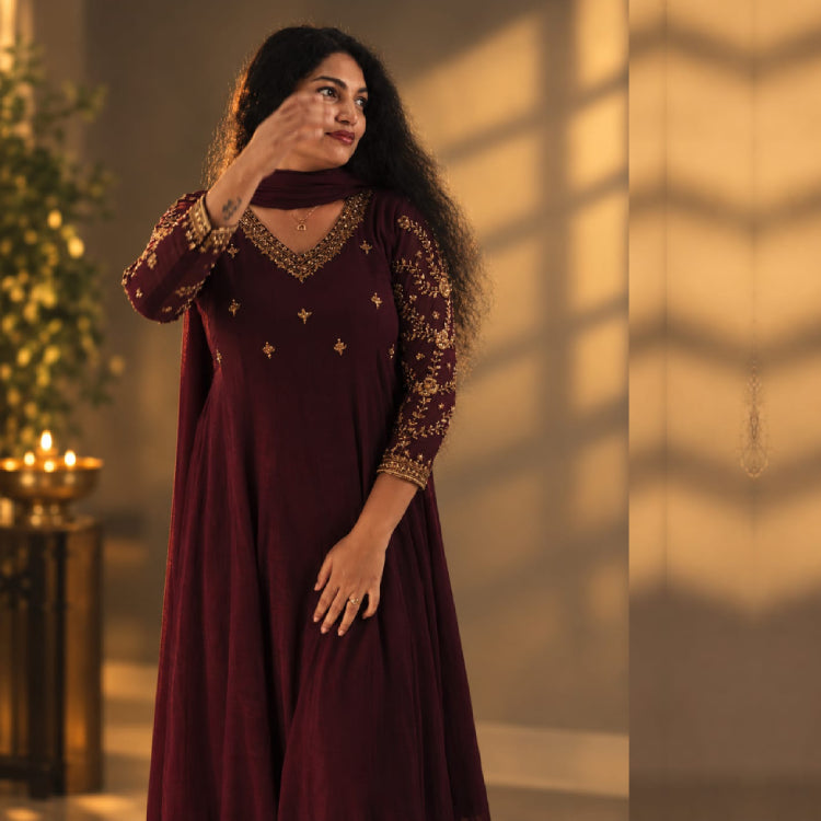 Burgundy paneled Anarkali dress by MIZHI featuring traditional Ajrak print with intricate pattern details.