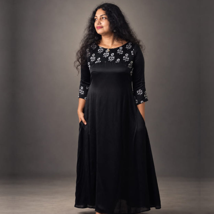 MIZHI modal silk kurti top with intricate embroidery, lightweight and soft fabric, displayed on a hanger against a neutral background.