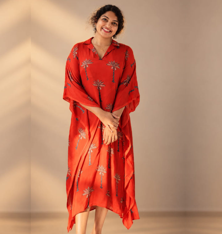 Red modal silk ajrakh kaftan by MIZHI featuring intricate traditional patterns and a flowing, comfortable design.