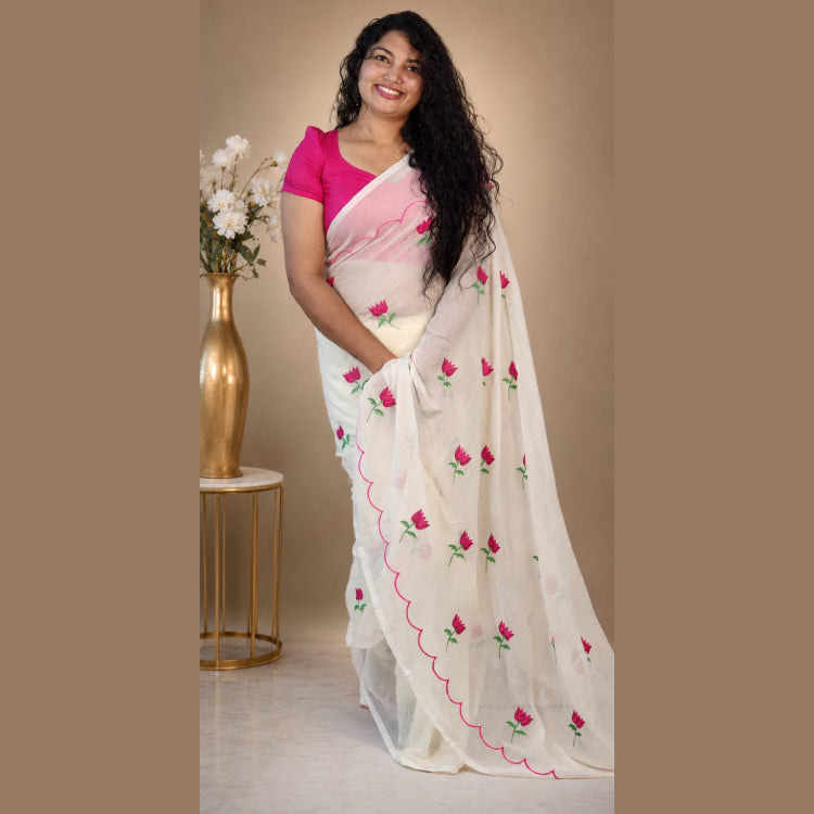 MIZHI mul cotton saree in soft, breathable fabric with intricate traditional patterns, displayed on a hanger.