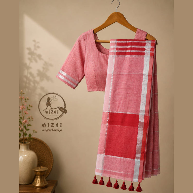 MIZHI mul cotton saree in soft, breathable fabric with intricate traditional patterns displayed on a hanger.