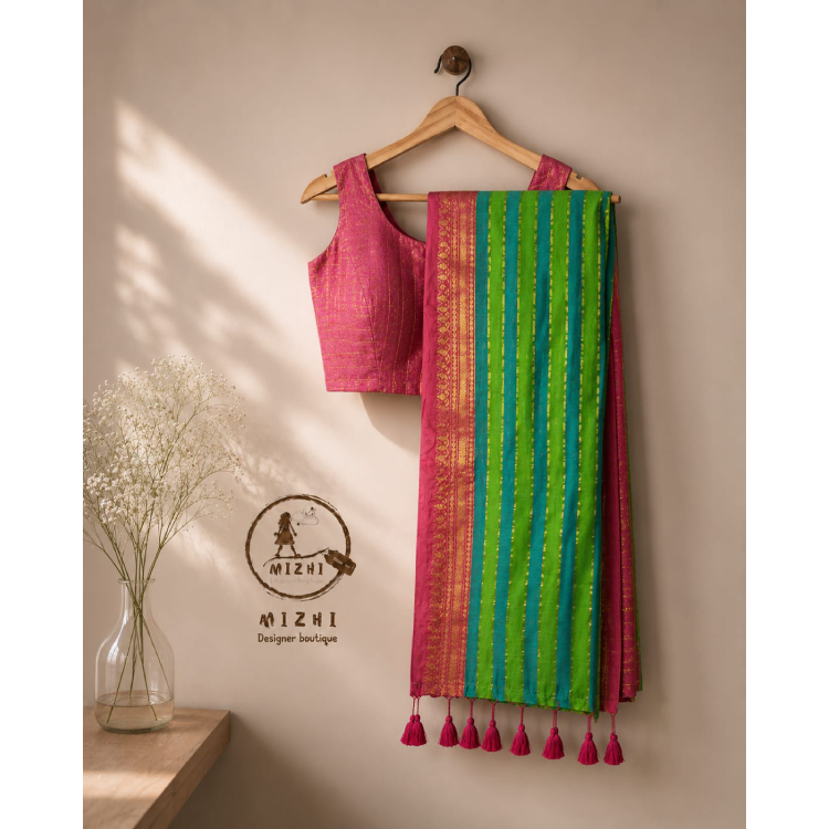 MIZHI mul cotton saree with intricate traditional patterns and soft fabric, draped elegantly on a mannequin.