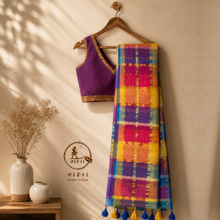 Vibrant multicolored checked MIZHI mul cotton saree with bold pattern and lightweight fabric, displayed in a front view.