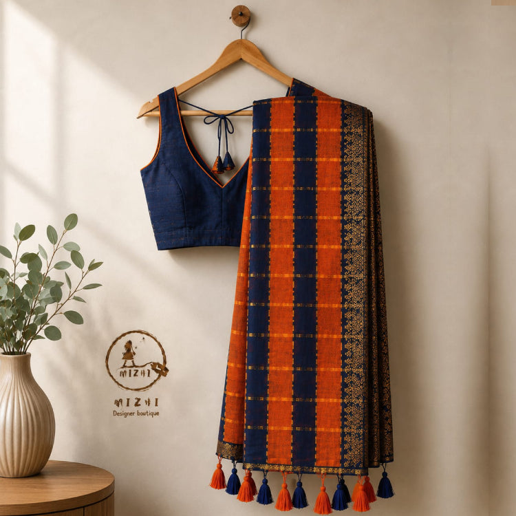 Vibrant orange and navy blue checked Mul Cotton saree by MIZHI with traditional pattern and lightweight fabric.