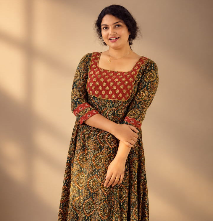 MIZHI paneled anarkali ajrakh with intricate traditional block print design and vibrant colors, showcasing detailed craftsmanship.
