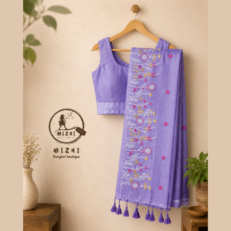 Purple MIZHI embroidered mul cotton saree with intricate designs, showcasing traditional craftsmanship and vibrant fabric details.