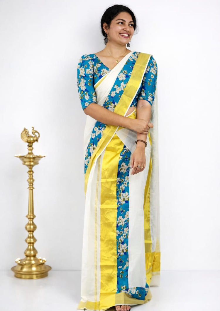 MIZHI ready-to-wear set mundu with matching blouse piece, traditional Indian clothing, white with gold border, displayed flat.
