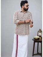 White Ajrakh shirt with lotus print and matching mundu by MIZHI, showcasing traditional Indian textile design.