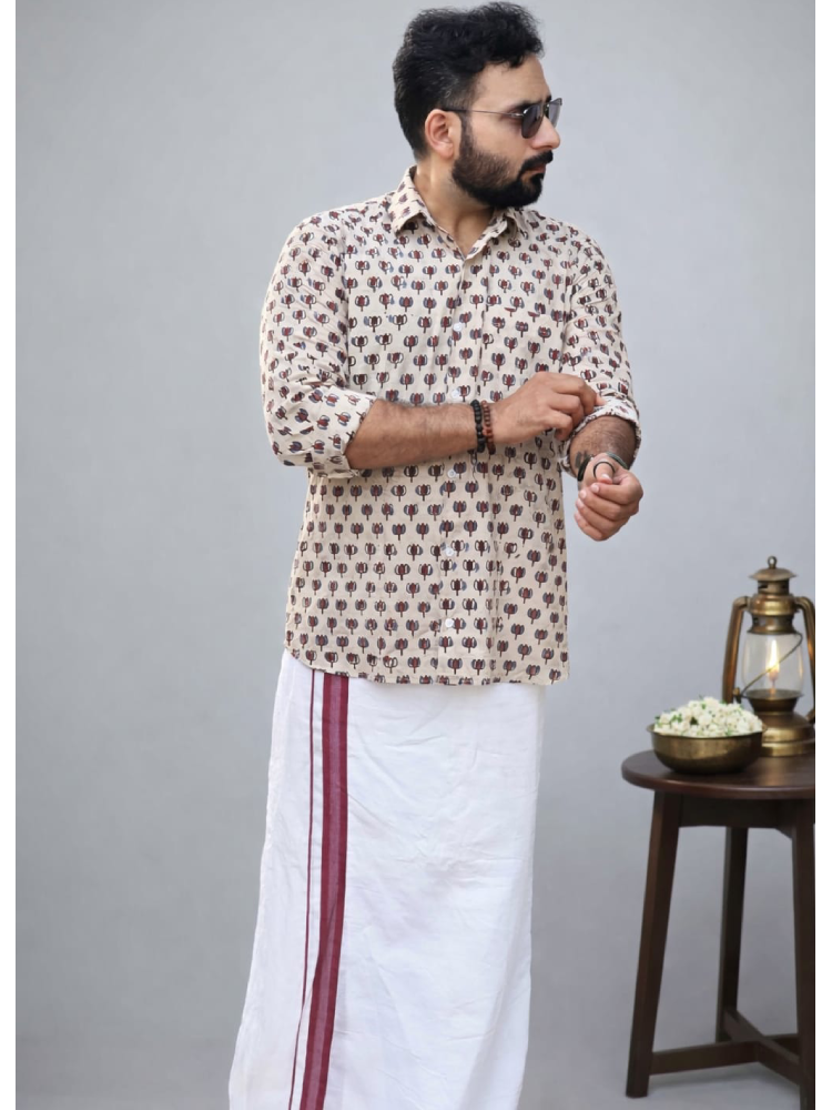White Ajrakh shirt with lotus print and matching mundu by MIZHI, showcasing traditional Indian textile design.