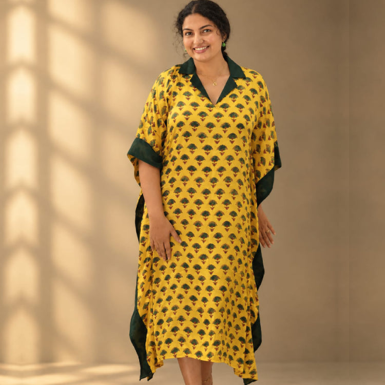Yellow Ajrakh Modal Silk Kaftan with traditional print by MIZHI, showcasing vibrant colors and flowing, elegant fabric.